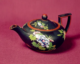 Black basalt Wedgwood teapot, enamelled with flowers, c.1840-50